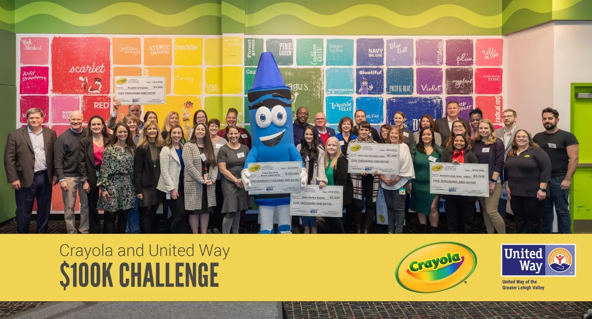 Image of donors holding oversized checks