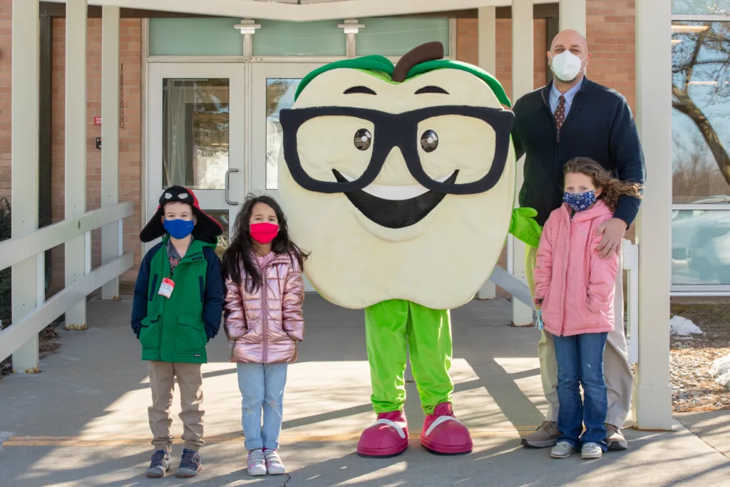 elementary school children with Lehigh Valley Reads mascot, Corey