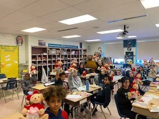 5th grade class at Donegan Elementary School in Bethlehem holding donated Godiva teddy bears
