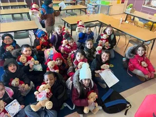 Kindergarten class at Donegan Elementary School in Bethlehem holding donated Godiva teddy bears