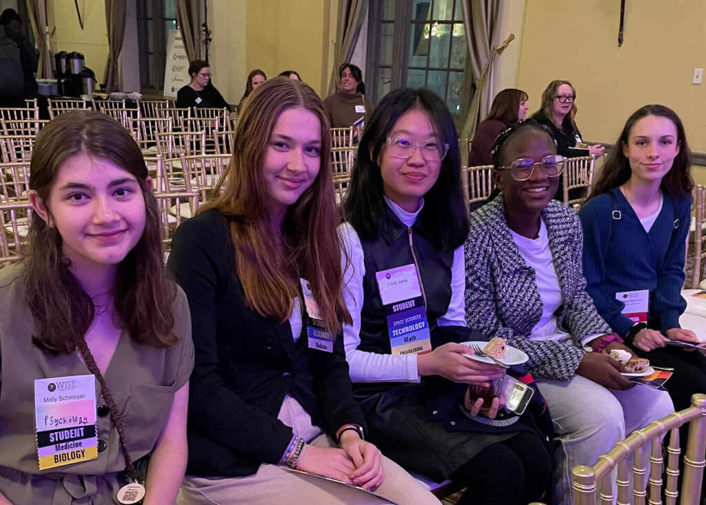 5 women sitting at the Women in Science & Engineering Forum