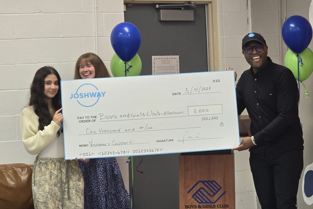 David Robertson of JOSHWAY presenting a check to Boys & Girls Club of Allentown member for Visionary Support
